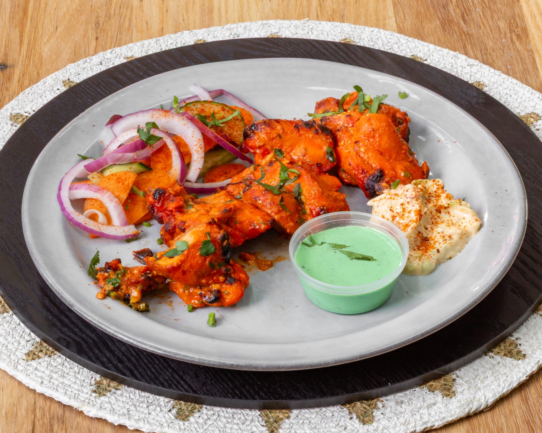 Tandoori chicken with onion salad, mint chutney and raita