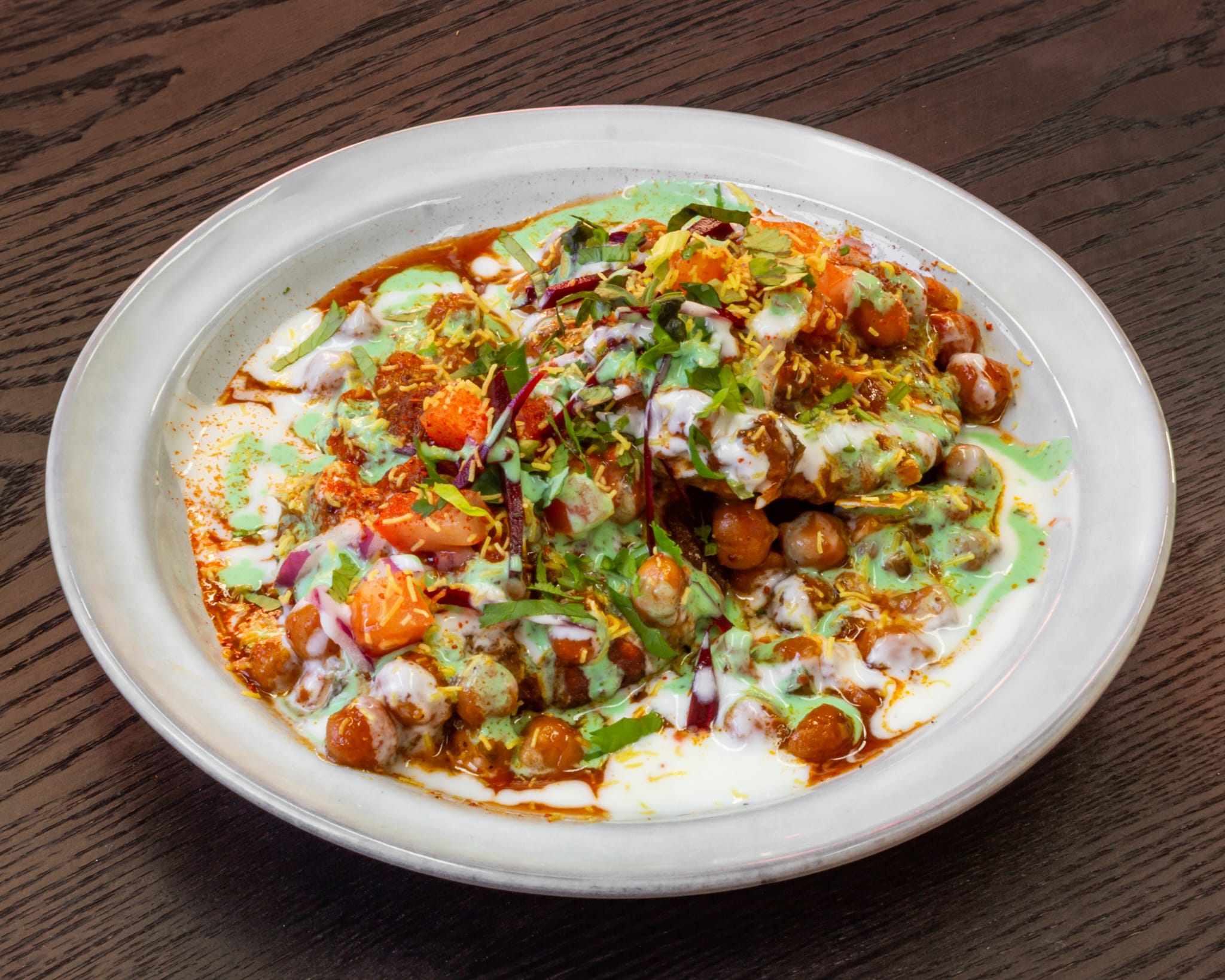 Chaat with chickpeas, yoghurt, mint and tamarind chutney and sev