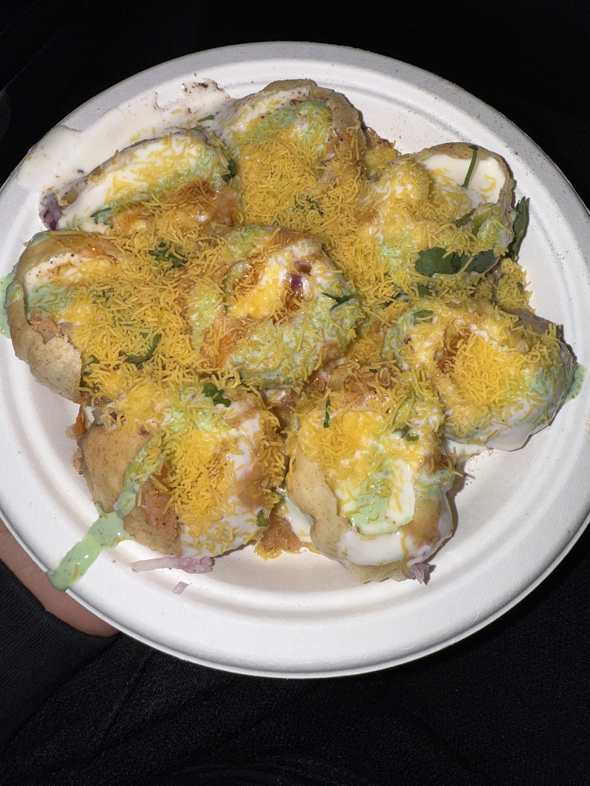 Dahi puri chaat in a takeaway bowl